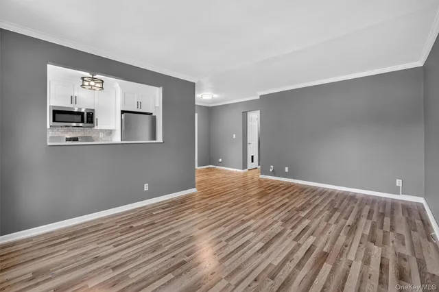 a view of a livingroom with wooden floor