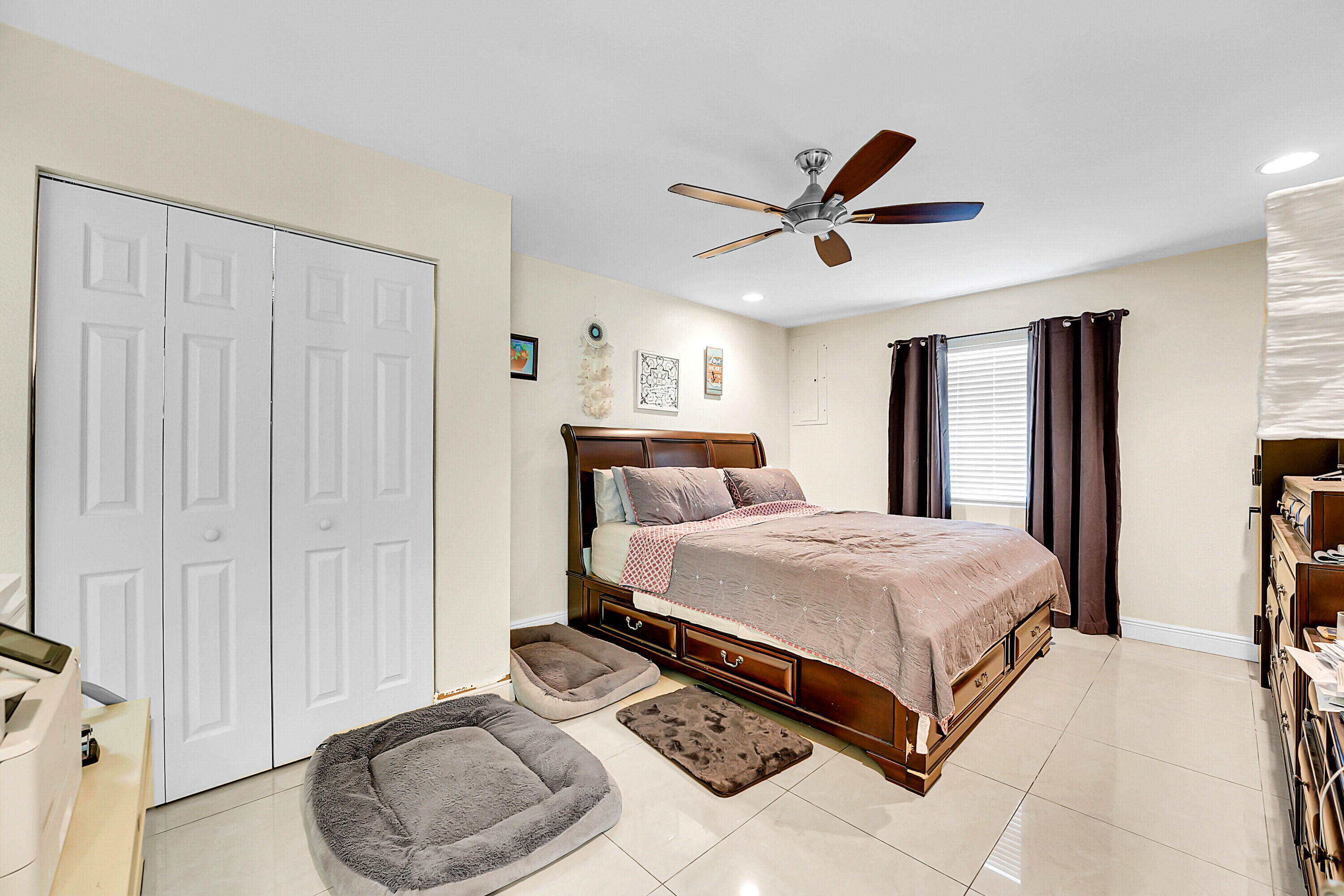2856 Harson Way Fort Pierce, FL 34946 - Photo 15 of 37 a bedroom with a bed and closet