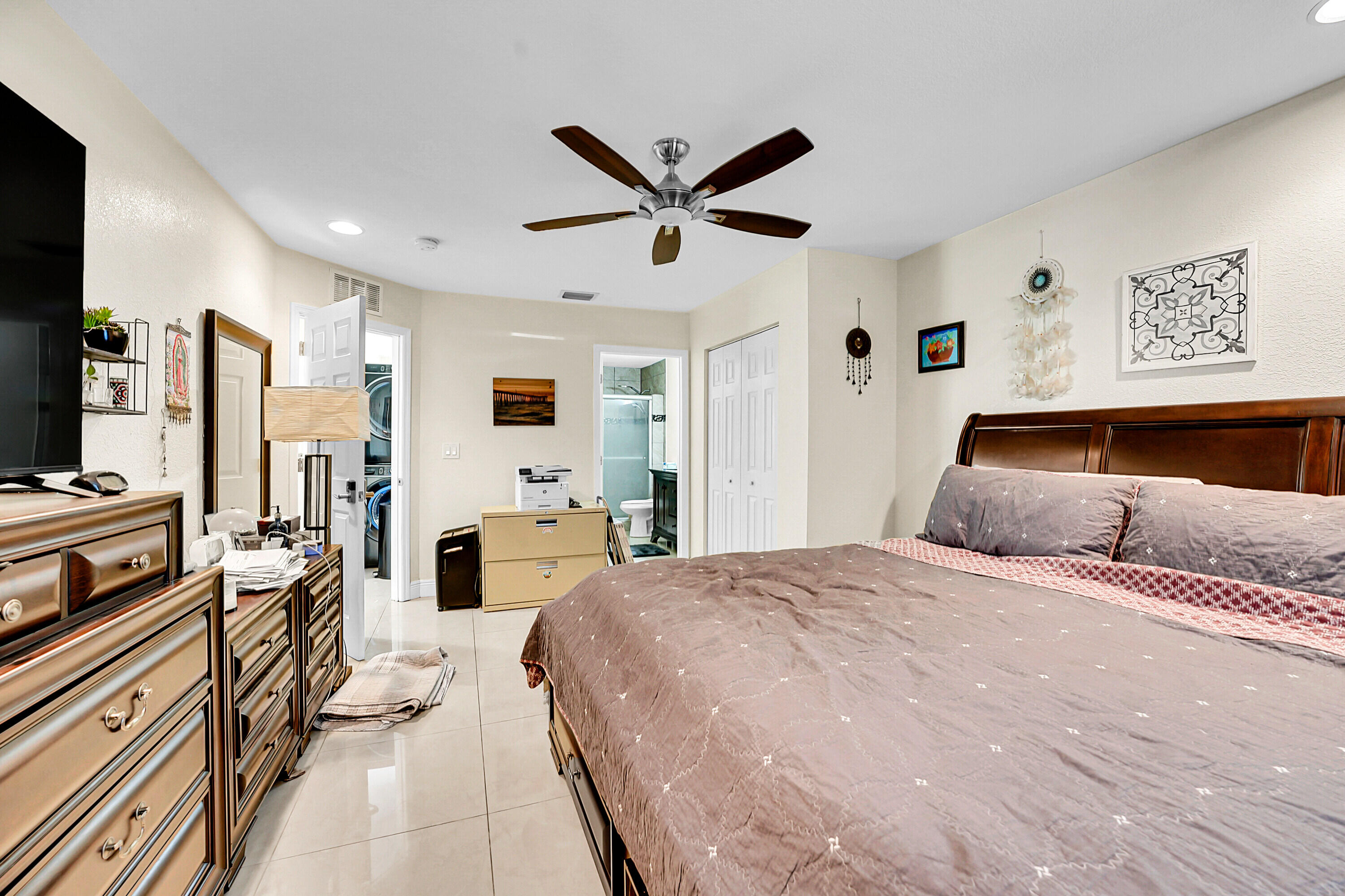 2856 Harson Way Fort Pierce, FL 34946 - Photo 16 of 37 a bedroom with a bed and ceiling fan