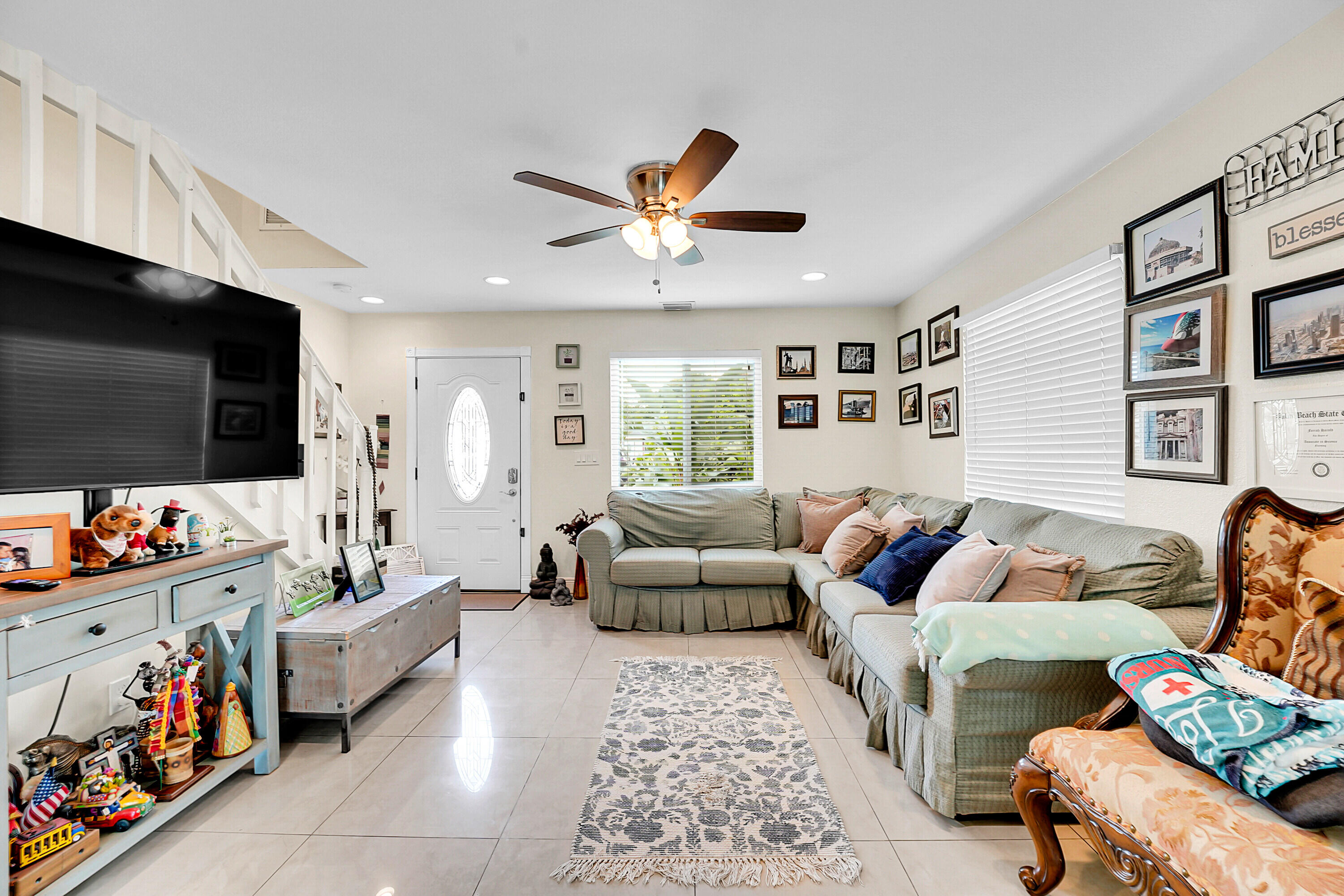2856 Harson Way Fort Pierce, FL 34946 - Photo 21 of 37 a living room with furniture and a flat screen tv