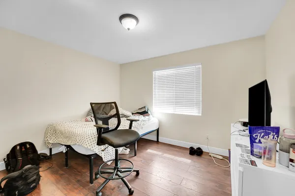 a livingroom with workspace and a window