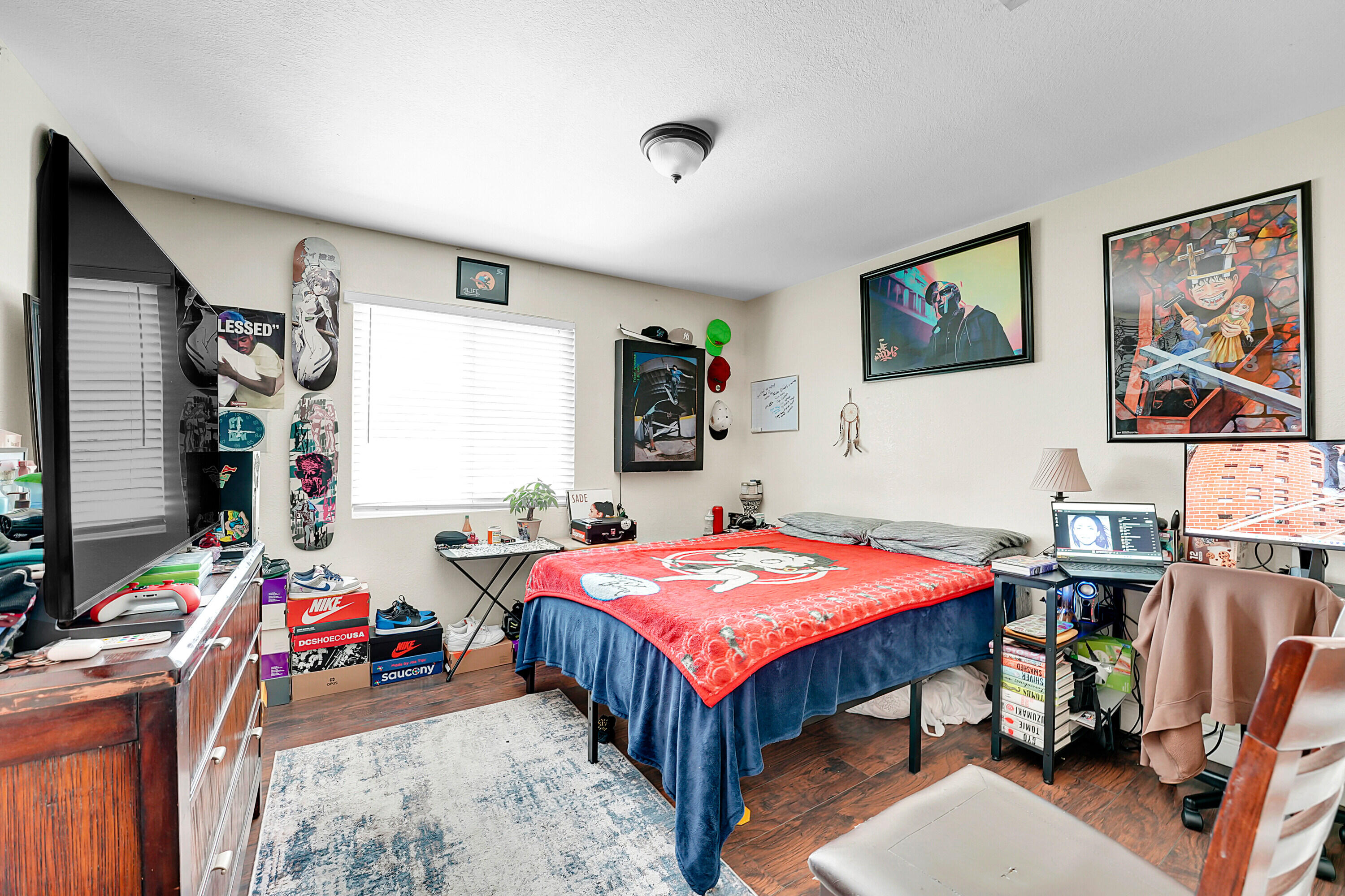 2856 Harson Way Fort Pierce, FL 34946 - Photo 29 of 37 a bedroom with a bed and a dresser in it