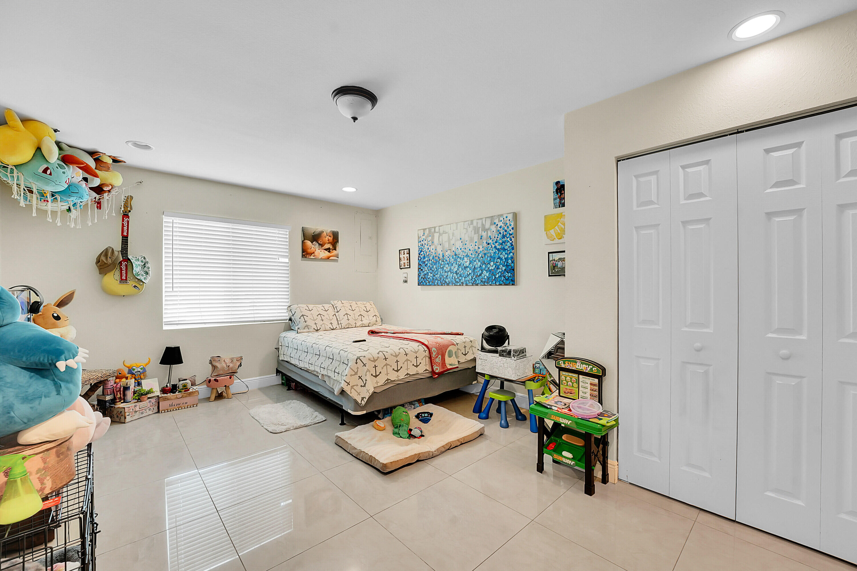 2856 Harson Way Fort Pierce, FL 34946 - Photo 34 of 37 a bedroom with bed and a window