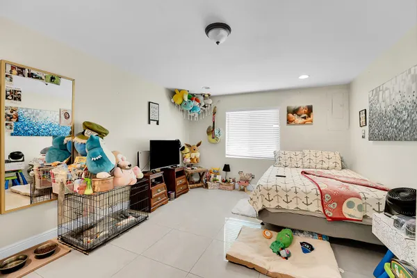 a bedroom with furniture and a wooden floor