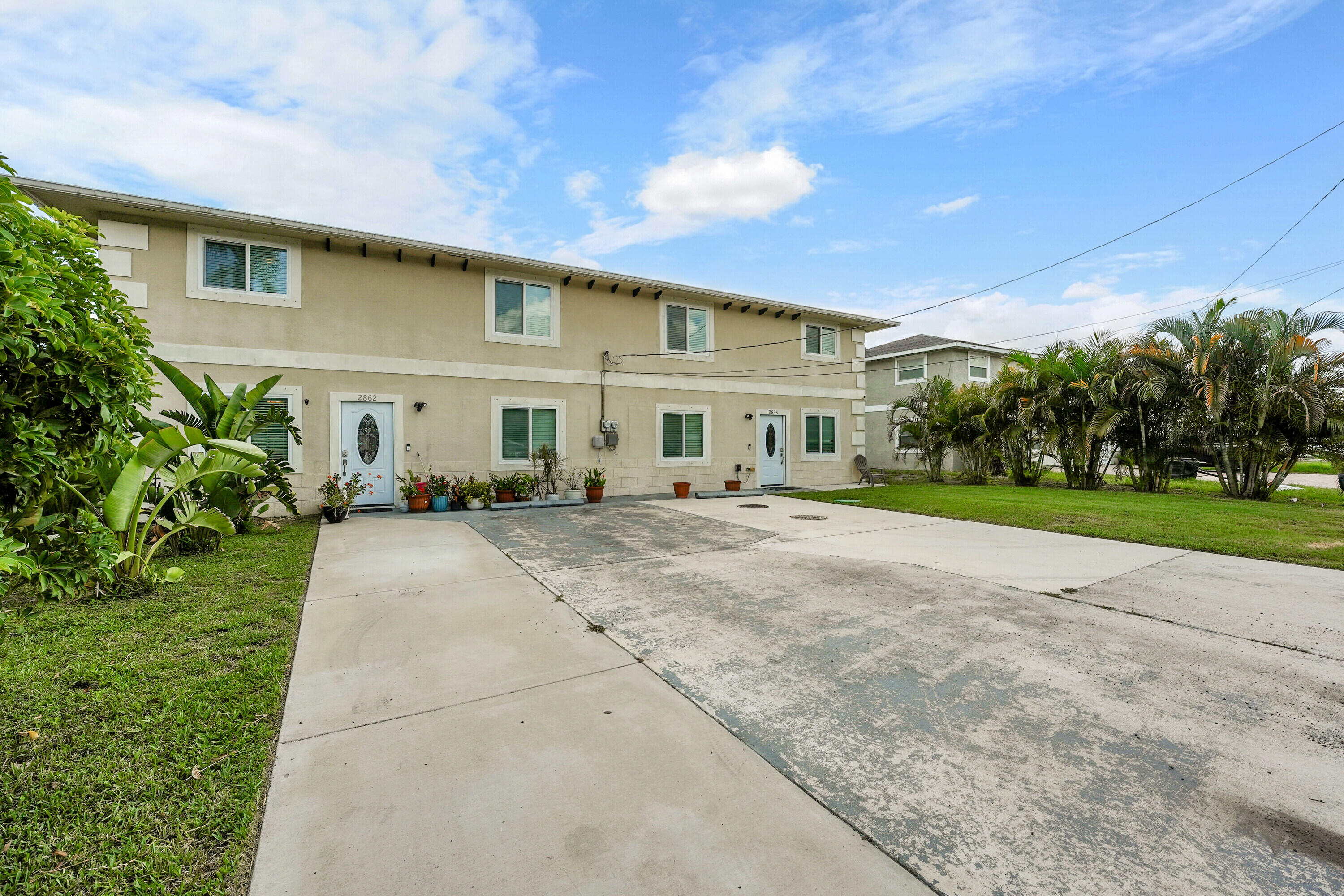 2856 Harson Way Fort Pierce, FL 34946 - Photo 36 of 37 a view of a building with a garden