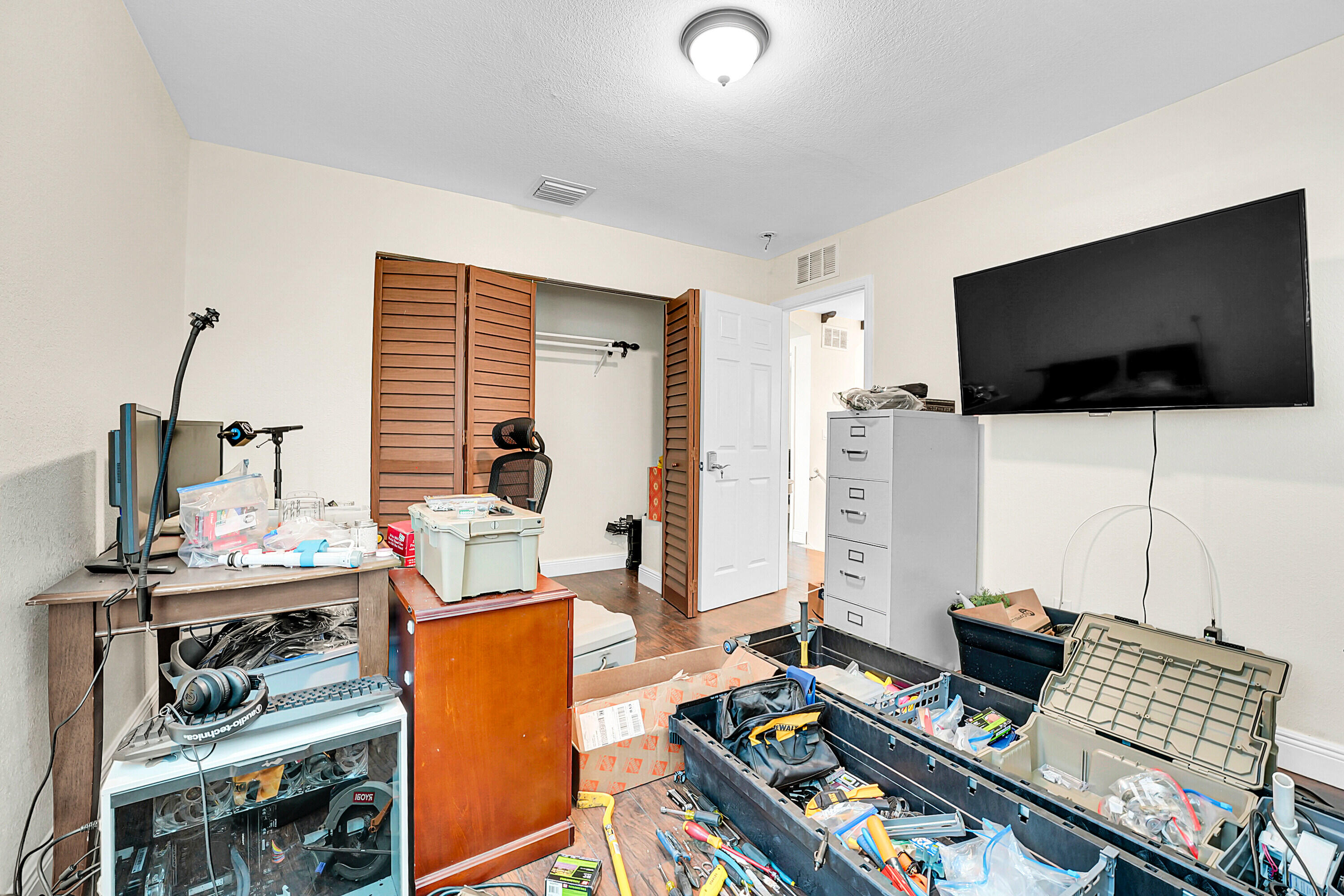 2856 Harson Way Fort Pierce, FL 34946 - Photo 10 of 37 a living room with furniture and a flat screen tv