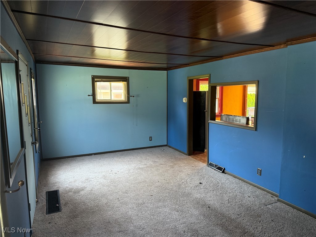6350 Meadowbrook Road Garfield Heights, OH 44125 - Photo 20 of 28 Spare room with carpet and wooden ceiling