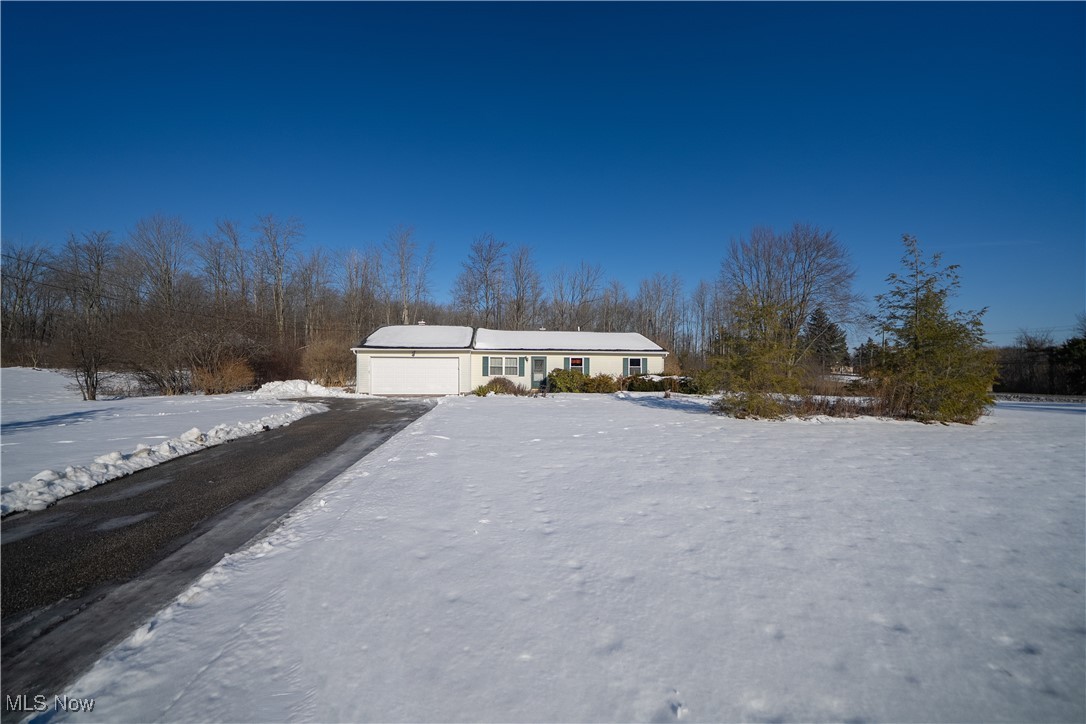 Ranch-style house featuring an attached garage