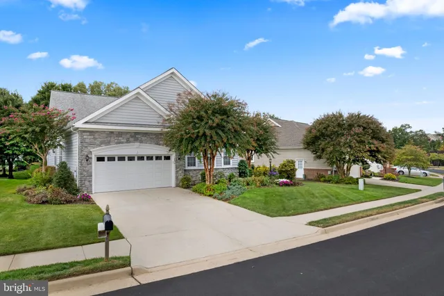 a view of a house with a yard and garage