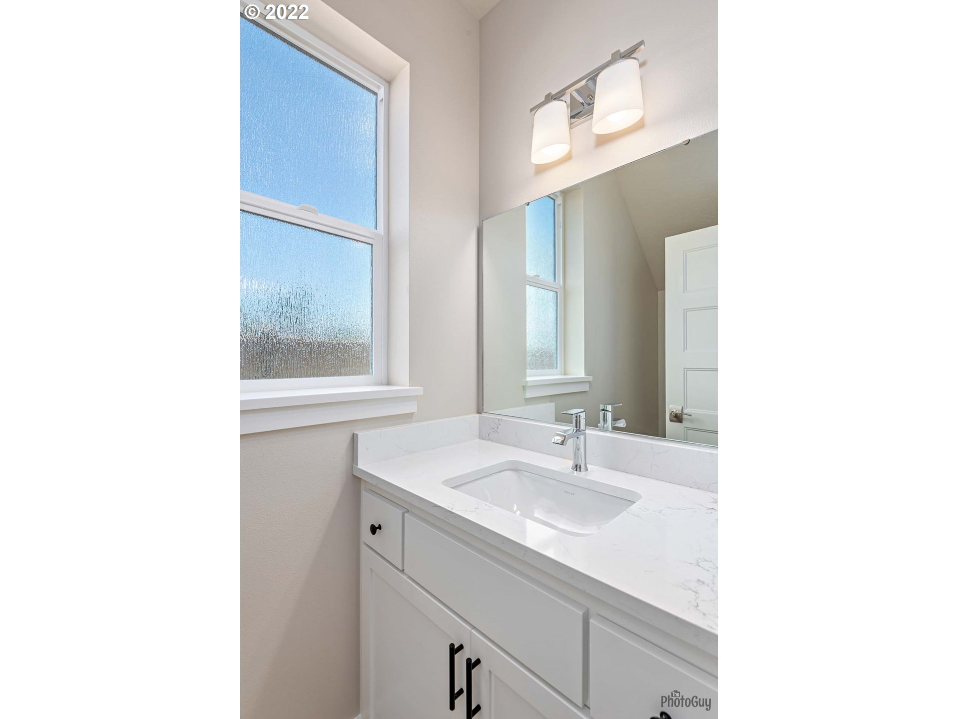 5319 High Banks Road Springfield, OR 97478 - Photo 14 of 32 a bathroom with a sink and a mirror