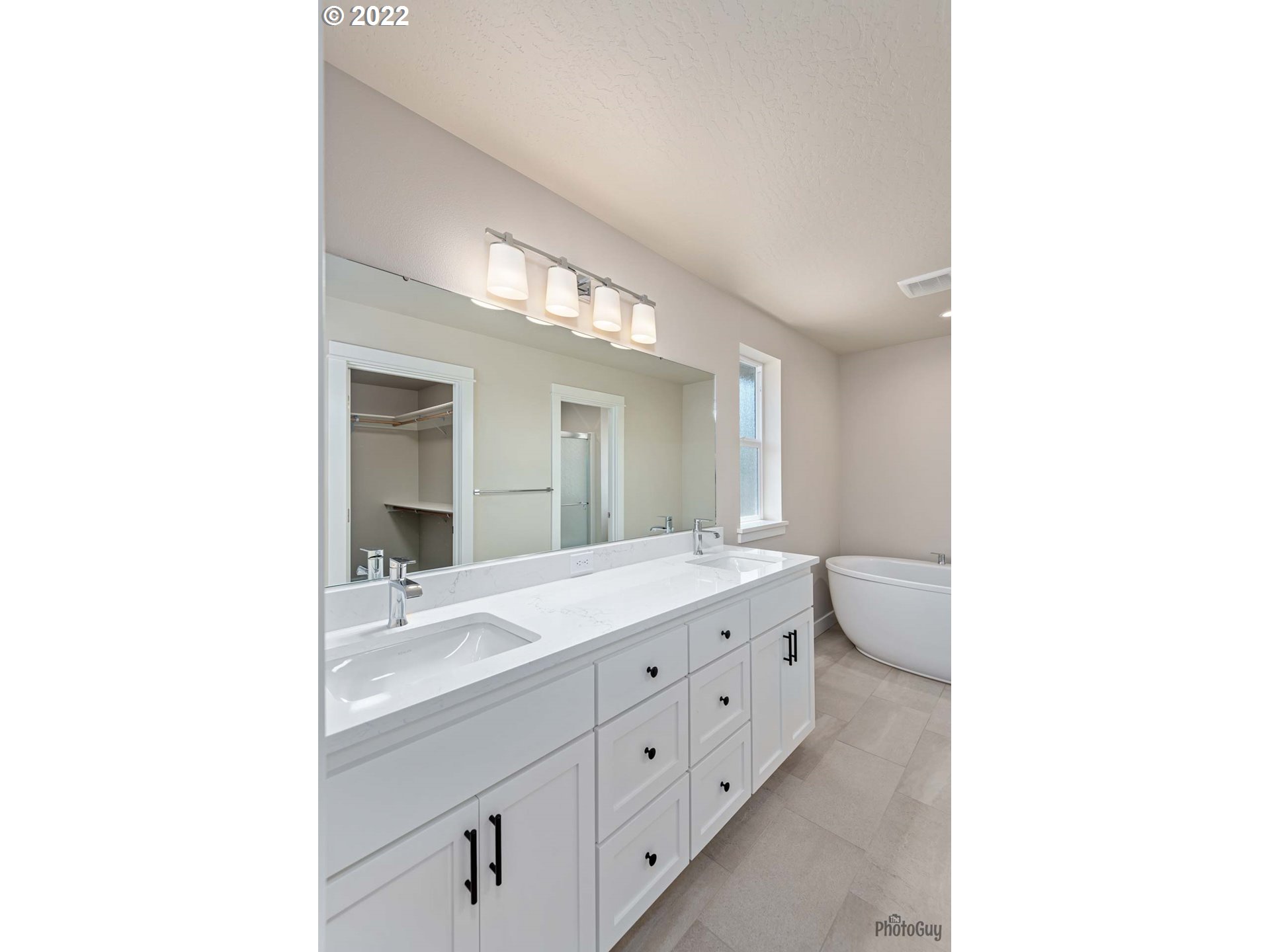 5319 High Banks Road Springfield, OR 97478 - Photo 18 of 32 a bathroom with a double vanity sink and mirror