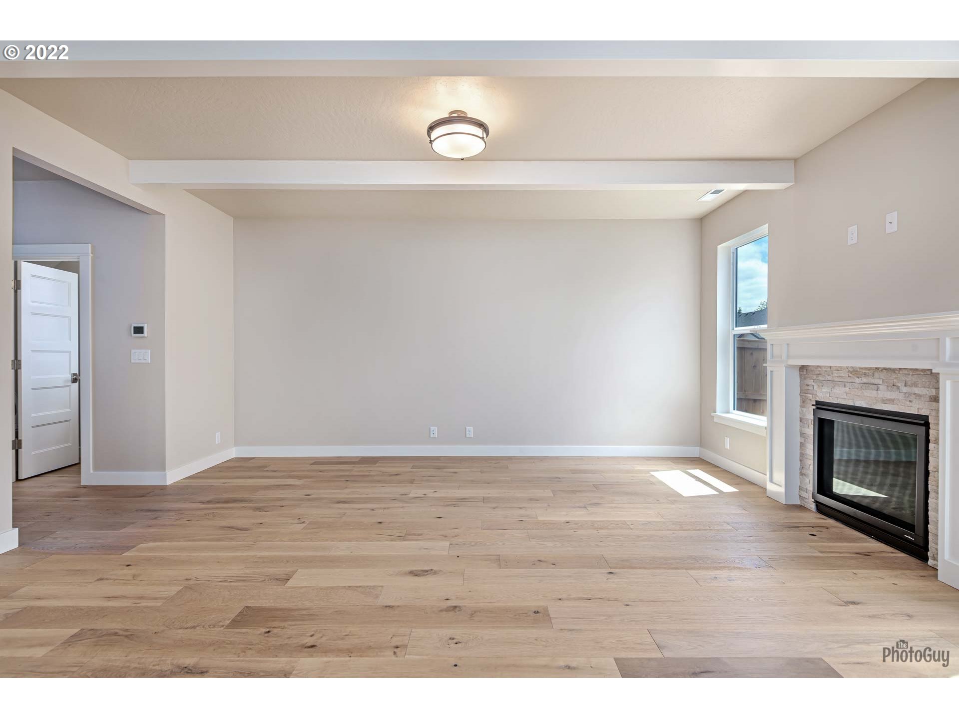 5319 High Banks Road Springfield, OR 97478 - Photo 5 of 32 a view of an empty room with wooden floor and a window