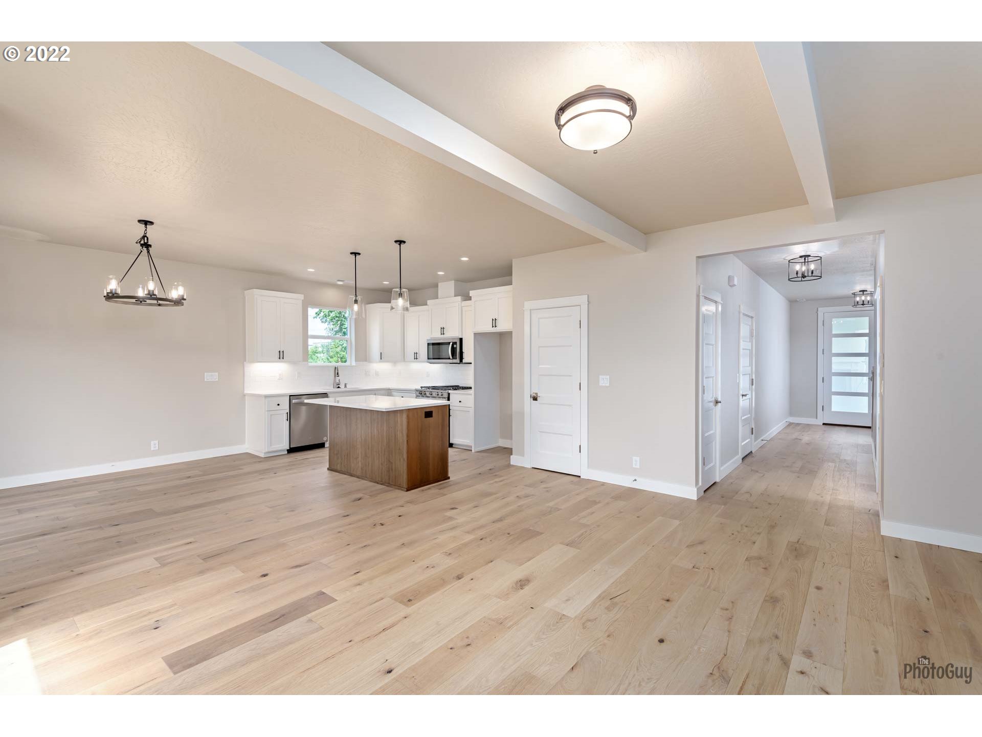 5319 High Banks Road Springfield, OR 97478 - Photo 7 of 32 a large white kitchen with wooden floors and kitchen view