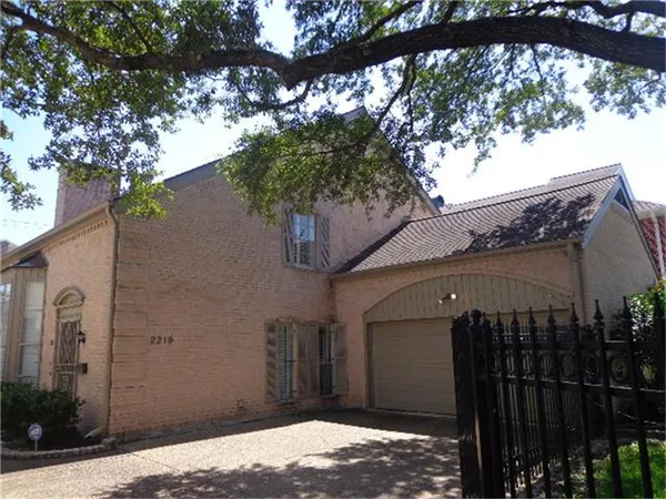 a view of a house with a tree