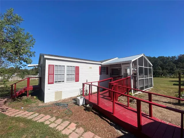 a view of a balcony with a dining space