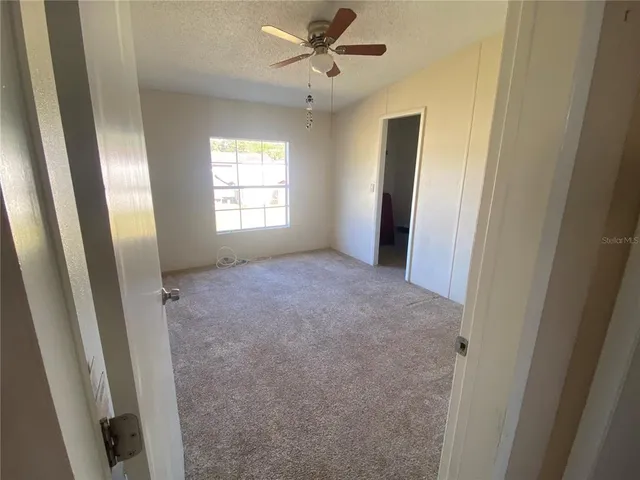 a bedroom with a bed and a walk in closet