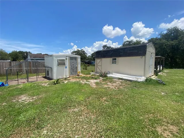 a view of yard with patio