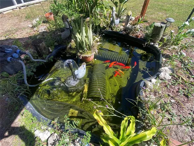 a view of a city from a balcony with furniture
