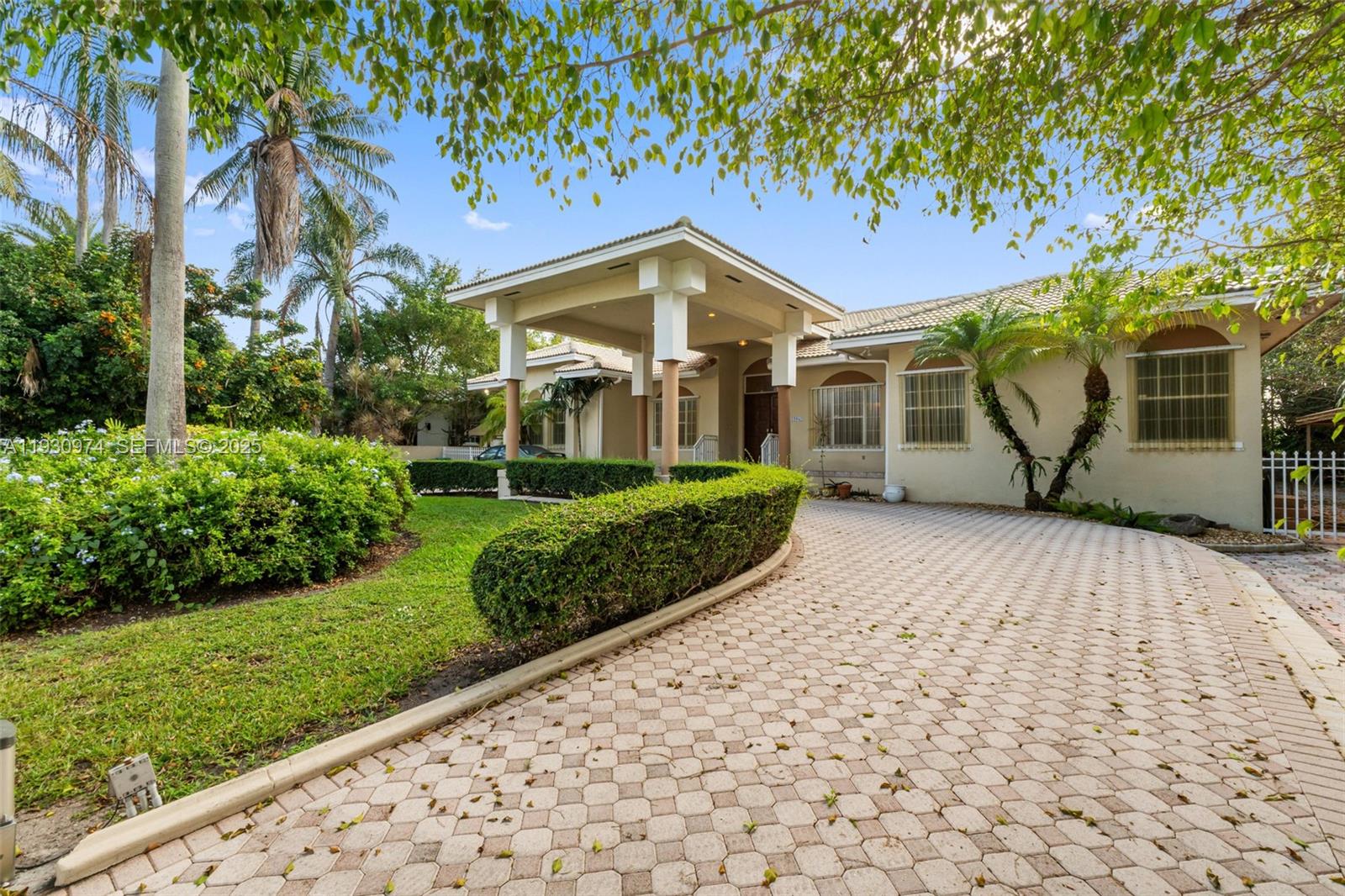 12982 Southwest 27th Street Miami, FL 33175 - Photo 1 of 43 a view of a house with a yard