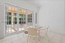 12982 Southwest 27th Street Miami, FL 33175 - Photo 12 of 43 a dining room with furniture and floor to ceiling window