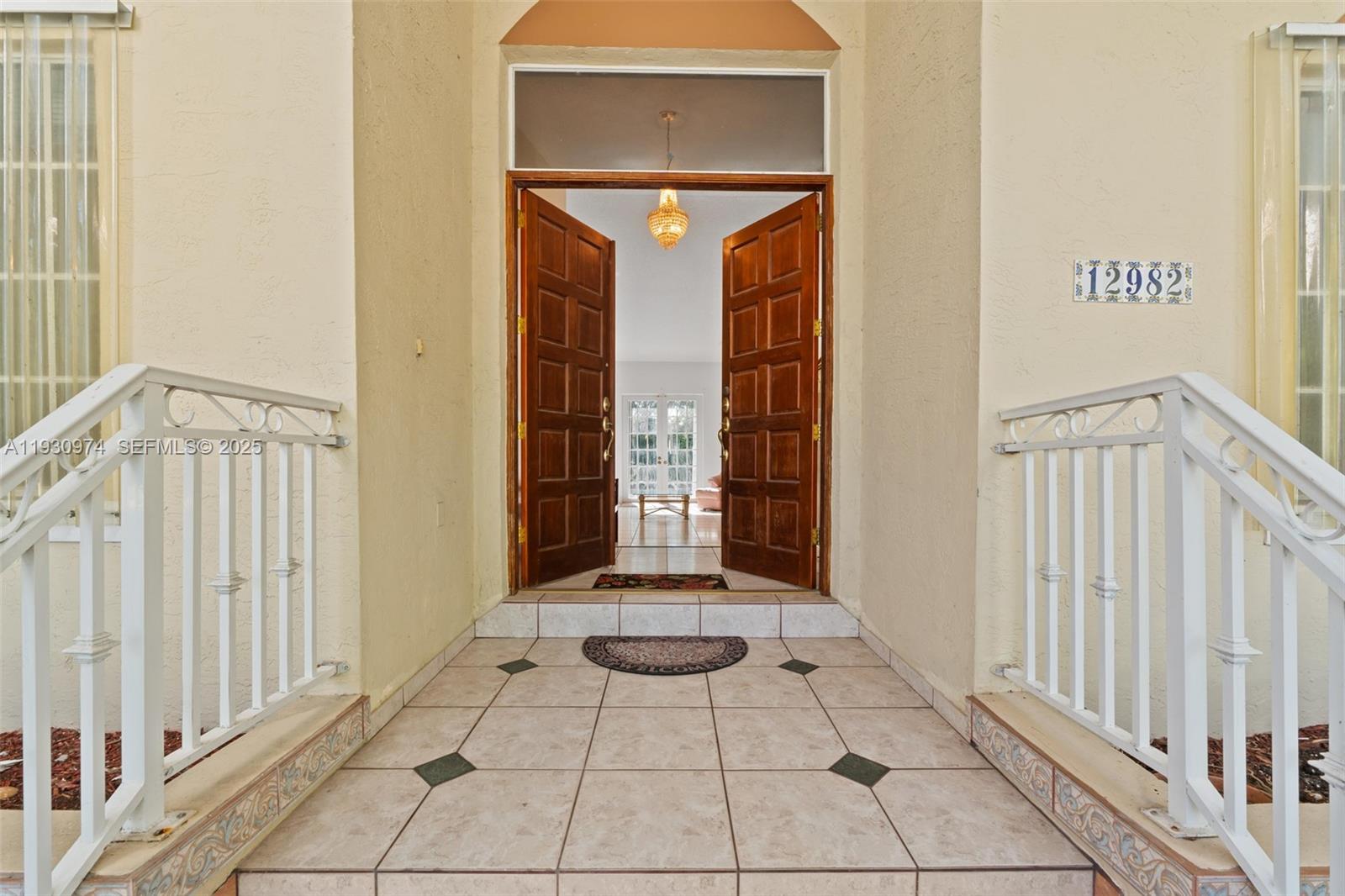 12982 Southwest 27th Street Miami, FL 33175 - Photo 24 of 43 a view of a hallway with entryway door