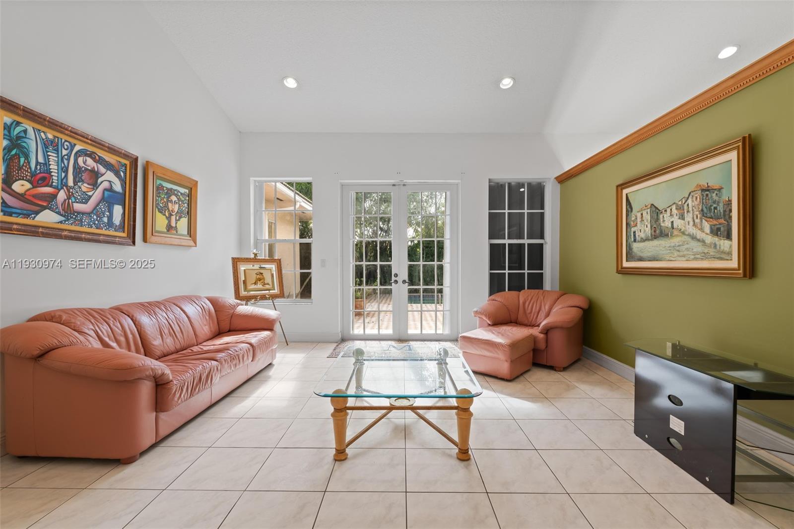 12982 Southwest 27th Street Miami, FL 33175 - Photo 25 of 43 a living room with furniture and a large window