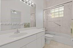 12982 Southwest 27th Street Miami, FL 33175 - Photo 27 of 43 a bathroom with a sink a toilet and shower