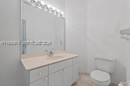 12982 Southwest 27th Street Miami, FL 33175 - Photo 28 of 43 a bathroom with a sink toilet and vanity