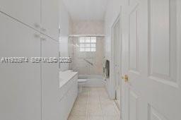 12982 Southwest 27th Street Miami, FL 33175 - Photo 34 of 43 a spacious bathroom with a bathtub and a shower