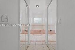 12982 Southwest 27th Street Miami, FL 33175 - Photo 36 of 43 a bathroom with a glass shower door