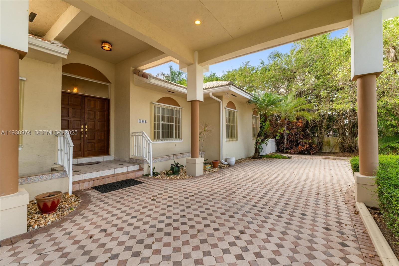 12982 Southwest 27th Street Miami, FL 33175 - Photo 40 of 43 a entryway view with a outdoor seating