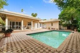 12982 Southwest 27th Street Miami, FL 33175 - Photo 42 of 43 a view of a house with a patio