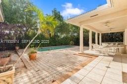 12982 Southwest 27th Street Miami, FL 33175 - Photo 10 of 43 a view of a house with backyard and sitting area