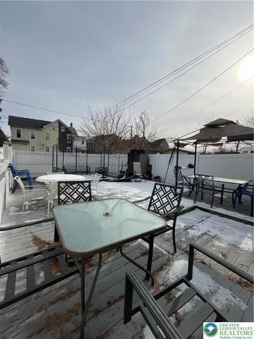 a view of a tables and chairs in the patio