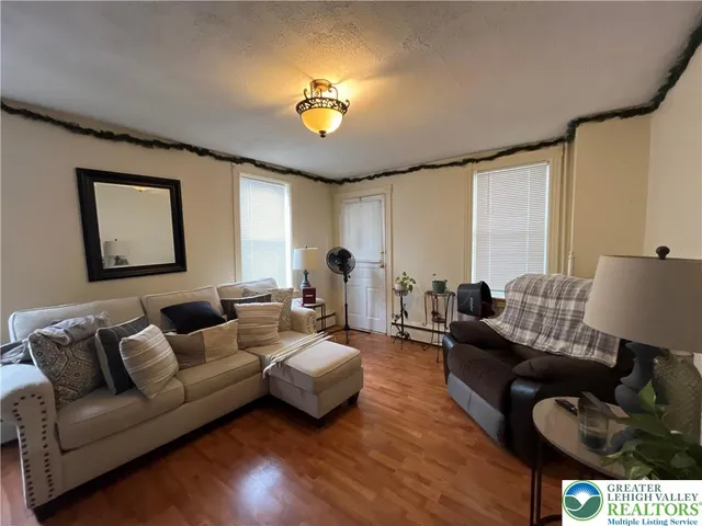 a living room with furniture and a large window