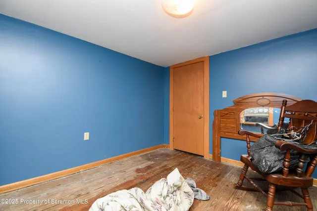 a room with furniture and wooden floor