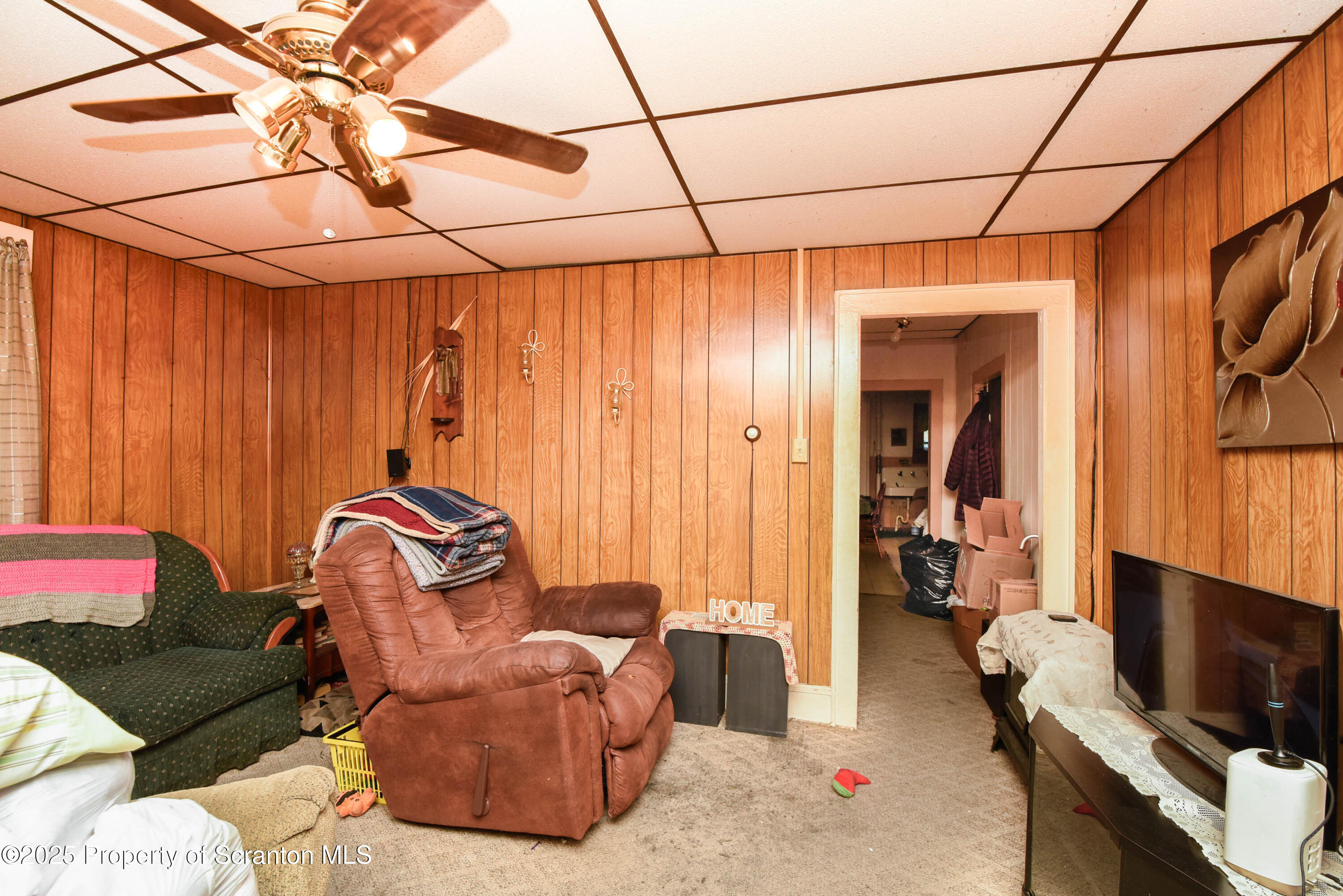 2706 North Main Avenue Scranton, PA 18508 - Photo 9 of 46 a living room with furniture a flat screen tv and a window