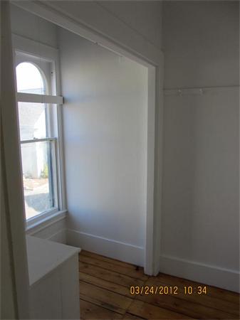 3 Proctor Street, Unit 1 Gloucester, MA 01930 - Photo 15 of 15 a view of an empty room with window and wooden floor