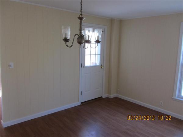 3 Proctor Street, Unit 1 Gloucester, MA 01930 - Photo 7 of 15 a view of empty room with wooden floor and ceiling fan