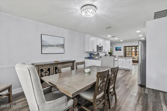 a living room with furniture and a book shelf