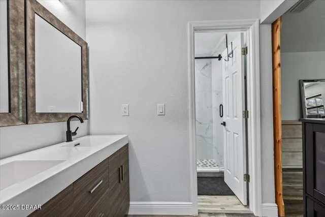 a bathroom with a shower and toilet