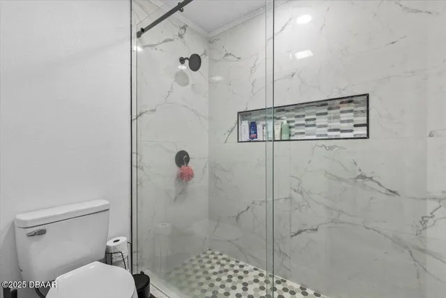 a view of a livingroom with furniture and closet