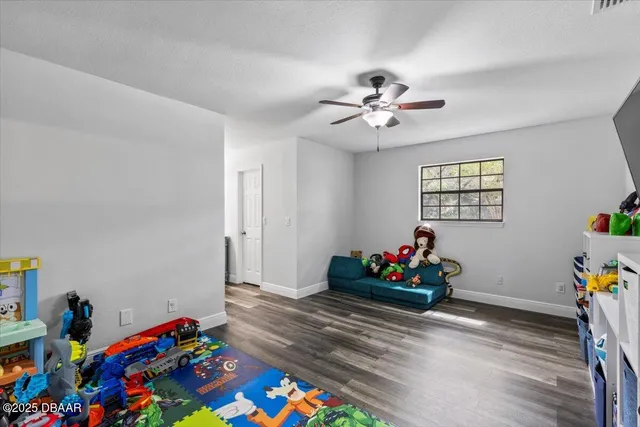a an empty room with toys and flat screen tv