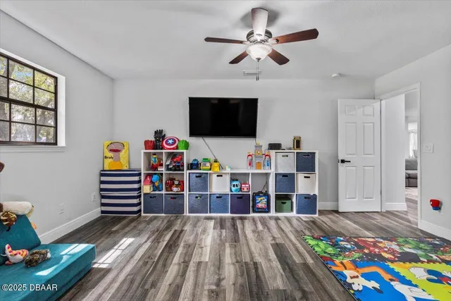 a living room with furniture and flowers