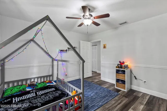a bedroom with furniture and a window