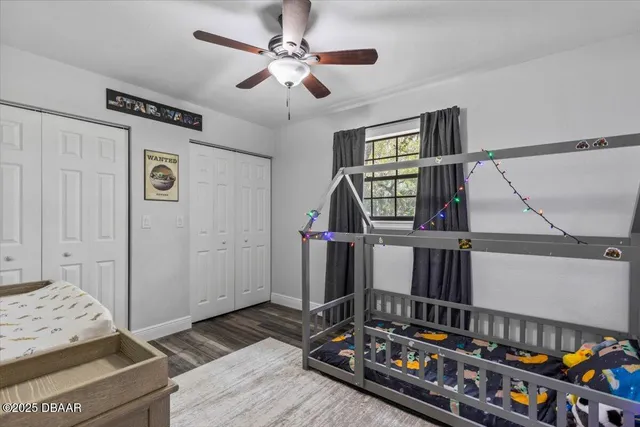 a bedroom with furniture and a baby crib