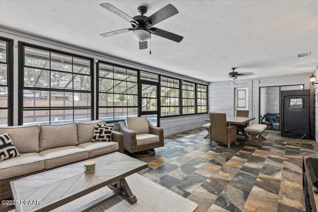 a large bedroom with a large bed and a large window