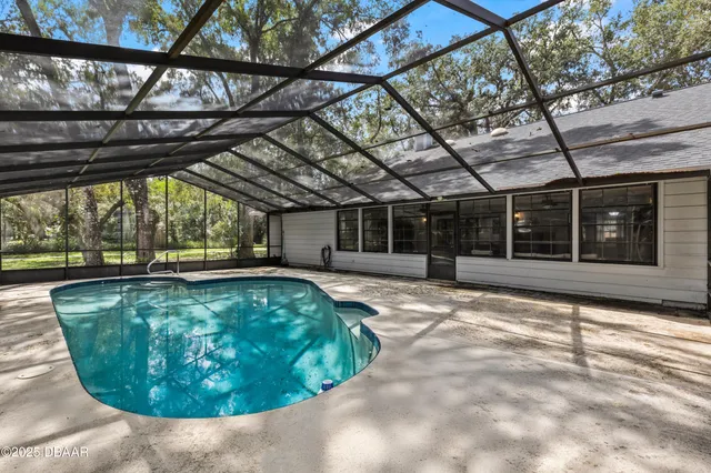a front view of a house with swimming pool