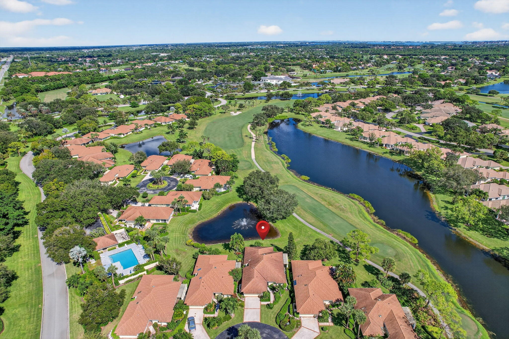 7036 Southeast Winged Foot Drive Stuart, FL 34997 - Photo 11 of 65 an aerial view of residential houses with outdoor space and trees