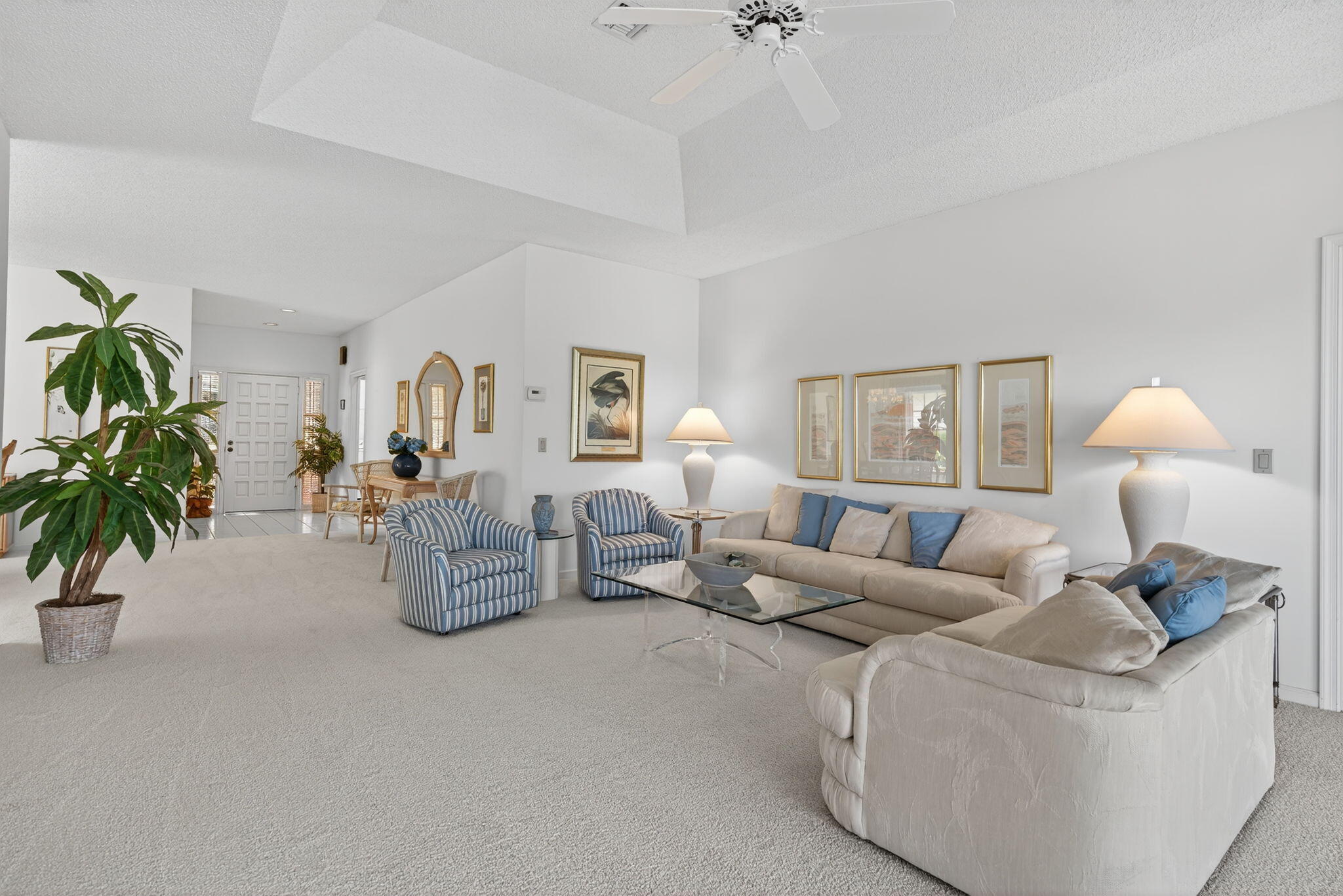 7036 Southeast Winged Foot Drive Stuart, FL 34997 - Photo 15 of 65 a living room with furniture and a potted plant